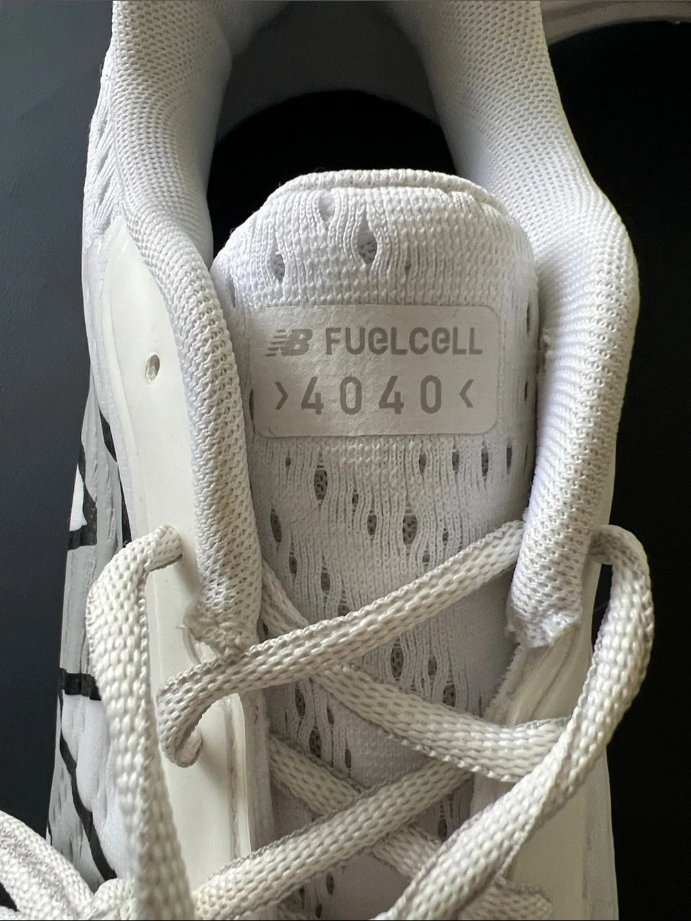 New Balance White Baseball Cleats with Black Logo